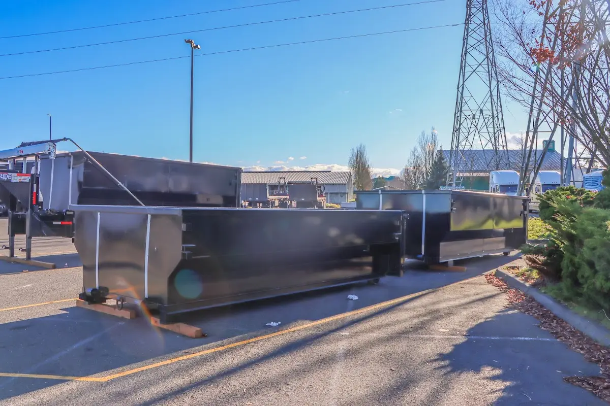Roll-off dumpster ready for waste disposal at job site for 15 Yard Dumpster Rental in Commerce